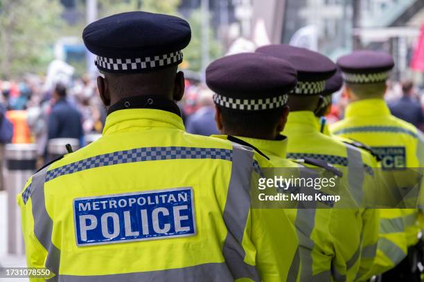 Metropolitan Police wait in line while policing a protest in the City of London on 18th October 2023 in London, United Kingdom. The Metropolitan...