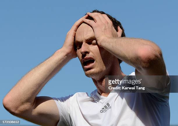 Andy Murray celebrates after beating Novak Djokovic in the Mens Singles Final on Day 13 of the Wimbledon Lawn Tennis Championships at the All England...