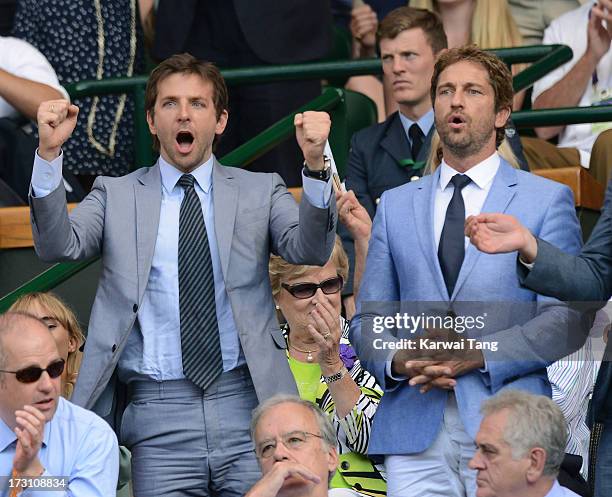 Bradley Cooper and Gerard Butler attend the Men's Singles Final between Novak Djokovic and Andy Murray on Day 13 of the Wimbledon Lawn Tennis...