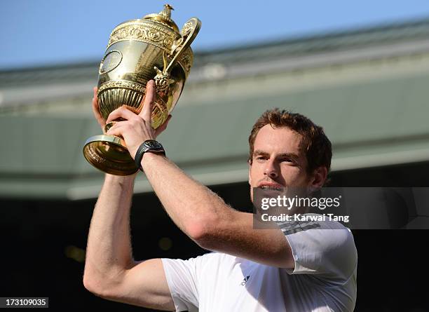 Andy Murray celebrates after beating Novak Djokovic in the Mens Singles Final on Day 13 of the Wimbledon Lawn Tennis Championships at the All England...