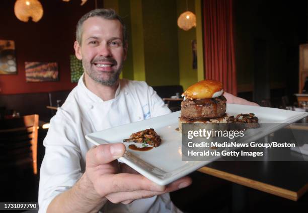 Portrait of Tavolo Chef Nuno Alves pours displaying a Crispy Mushroom Risotto, Grilled Meatball Patty and Poached Egg called the "Loco Moco" on...