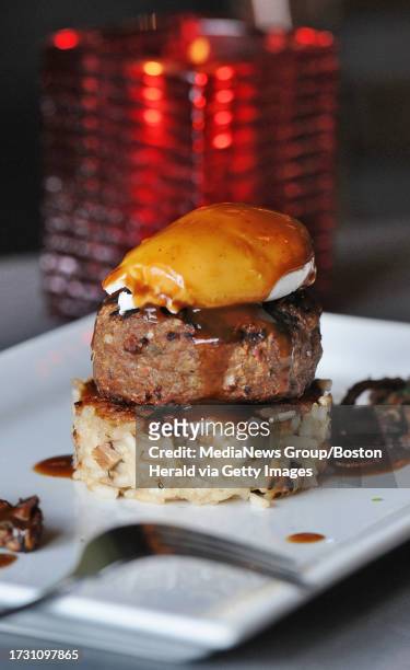 Detail shows a Crispy Mushroom Risotto, Grilled Meatball Patty and Poached Egg called the "Loco Moco" on Thursday, December 18, 2014 by Tavolo Chef...