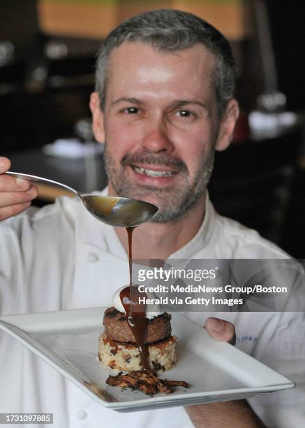 Tavolo Chef Nuno Alves pours a Chanterrelle Mushroom Sauce atop a Crispy Mushroom Risotto, Grilled Meatball Patty and Poached Egg called the "Loco...