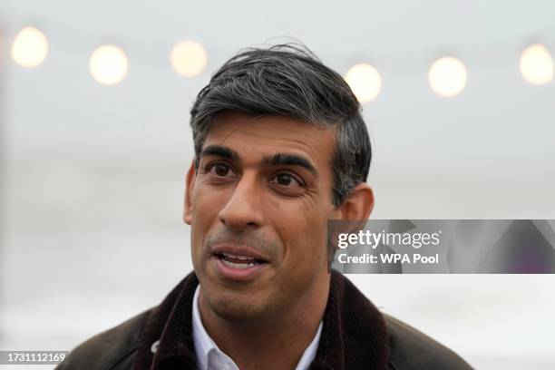 British Prime Minister Rishi Sunak speaks to a TV reporter during his visit to Clacton-on-Sea on October 18, 2023 in Clacton-on-Sea, United Kingdom.