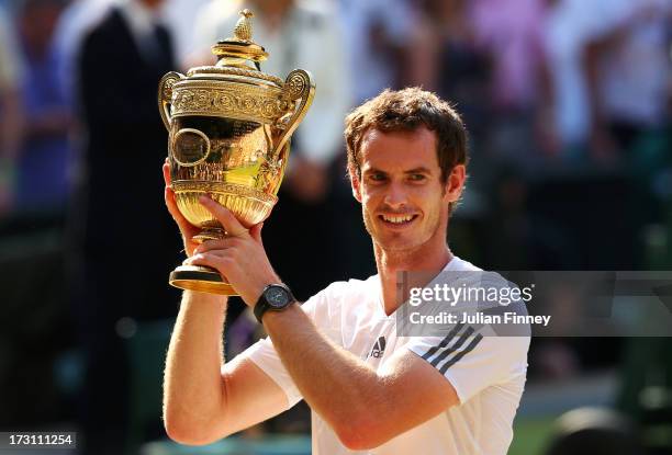 Andy Murray of Great Britain poses with the Gentlemen's Singles Trophy following his victory in the Gentlemen's Singles Final match against Novak...