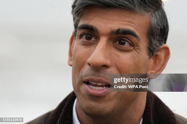 British Prime Minister Rishi Sunak speaks to a TV reporter during his visit to Clacton-on-Sea on October 18, 2023 in Clacton-on-Sea, United Kingdom.