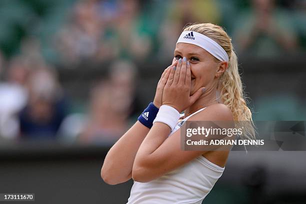 France's Kristina Mladenovic celebrates after she and her partner Canada's Daniel Nestor beat Brazil's Bruno Soares and US player Lisa Raymond in the...