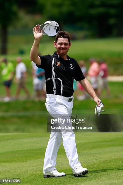 Louis Oosthuizen of South Africa reacts after after eagle on the second hole during the final round of the Greenbrier Classic at the Old White TPC on...