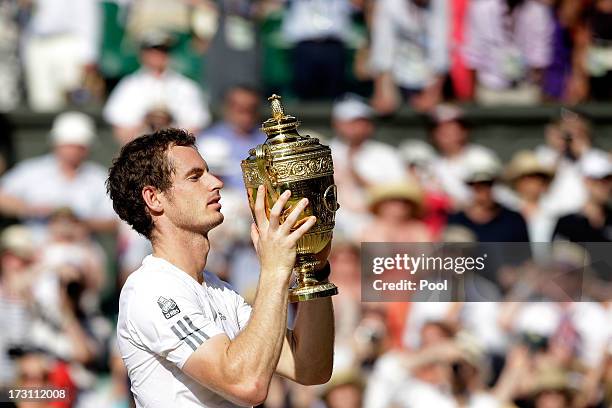 Andy Murray of Great Britain poses with the Gentlemen's Singles Trophy following his victory in the Gentlemen's Singles Final match against Novak...