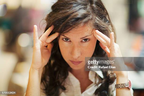 concentrated woman - hypnotist stock pictures, royalty-free photos & images