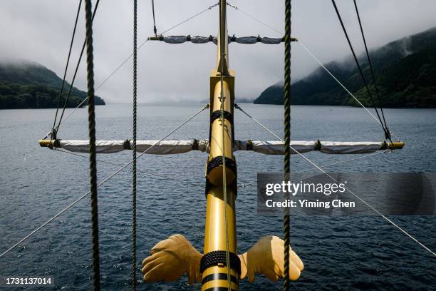 hakone, kanagawa prefecture, japan - july 16, 2023: bowsprit of the sigh-seeing pirate ship queen ashinoko on misty ashinoko lake - pirate flag stock pictures, royalty-free photos & images