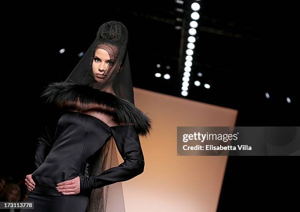 Model walks the runway during Jean Paul Gaultier Houte Couture Paris fashion show as part of AltaRoma AltaModa Fashion Week at Santo Spirito in...