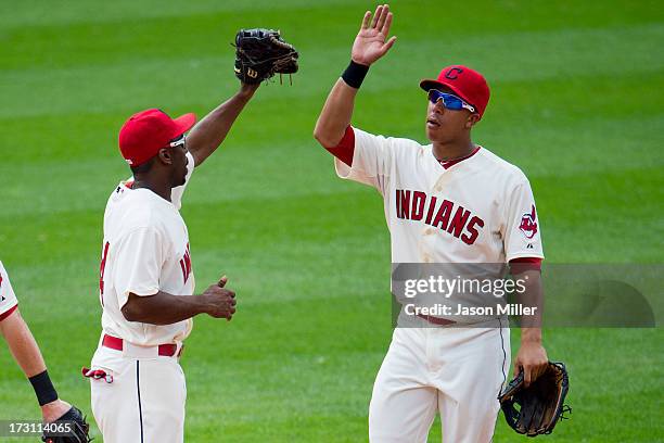 Michael Bourn celebrates with Michael Brantley of the Cleveland Indians after the Indians defeated the Detroit Tigers at Progressive Field on July 7,...