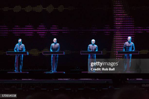 Ralf Hutter, Henning Schmitz, Fritz Hilpert and Falk Grieffenhagen from Kraftwerk perform on stage on Day 4 of Roskilde Festival 2013 on July 7, 2013...