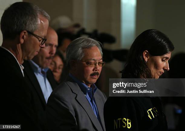 National Transportation Safety Board Chairwoman Deborah Hersman pauses while speaking during a news conference as San Francisco mayor Ed Lee looks on...