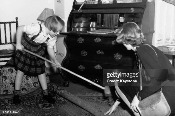 Princess Beatrix of the Netherlands sweeping up at her primary school, 'De Werkplaats' , in Bilthoven, Netherlands, 1946.