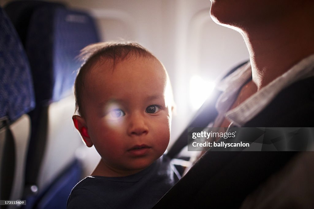 Mother and son on airplane