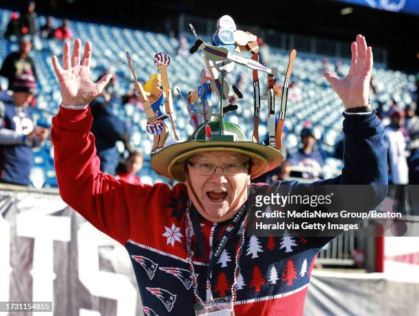 Bo Kennedy of Andover, MA, a season ticket holder for 46 years shows off his Patriots themed hat, complete with air pump at Gillette Stadium on...