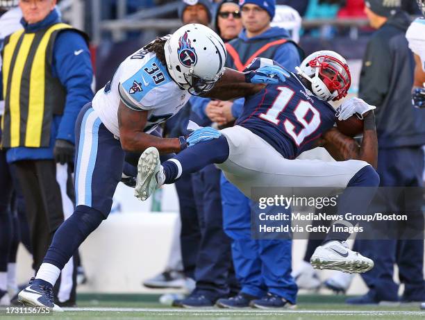 New England Patriots wide receiver Brandon LaFell id knocked out of bounds by Tennessee Titans free safety Daimion Stafford after a gain of 18 yards...