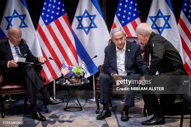 Israeli Prime Minister Benjamin Netanyahu , confers with Defense Minister Yoav Gallant , during their meeting with US President Joe Biden at the...