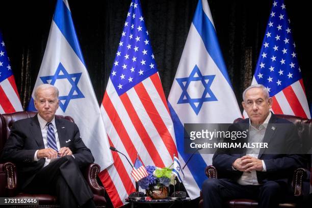 President Joe Biden , sits with Israeli Prime Minister Benjamin Netanyahu, at the start of the Israeli war cabinet meeting, in Tel Aviv on October 18...