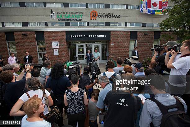 Canadian Prime Minister Stephen Harper addresses a press conference in the emergency camp set up at Lac-Mégantic high school on July 7, 2013 in...