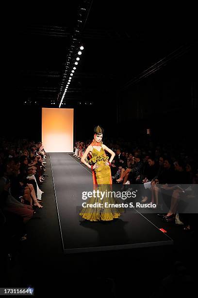 Model walks the runway during the Jean Paul Gaultier Couture fashion show as part of AltaRoma AltaModa Fashion Week Autumn/Winter 2013 on July 7,...