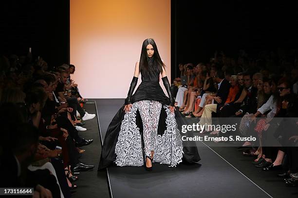 Model walks the runway during the Jean Paul Gaultier Couture fashion show as part of AltaRoma AltaModa Fashion Week Autumn/Winter 2013 on July 7,...