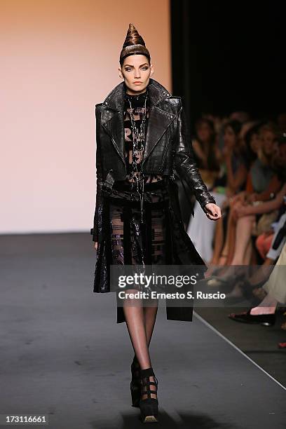 Model walks the runway during the Jean Paul Gaultier Couture fashion show as part of AltaRoma AltaModa Fashion Week Autumn/Winter 2013 on July 7,...