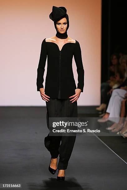 Model walks the runway during the Jean Paul Gaultier Couture fashion show as part of AltaRoma AltaModa Fashion Week Autumn/Winter 2013 on July 7,...