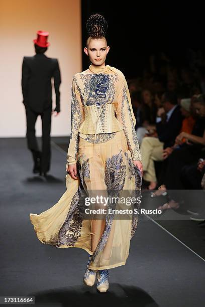 Model walks the runway during the Jean Paul Gaultier Couture fashion show as part of AltaRoma AltaModa Fashion Week Autumn/Winter 2013 on July 7,...