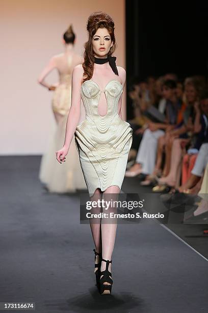 Model walks the runway during the Jean Paul Gaultier Couture fashion show as part of AltaRoma AltaModa Fashion Week Autumn/Winter 2013 on July 7,...