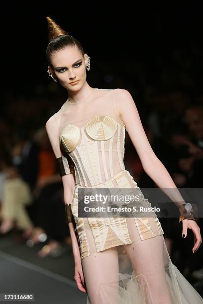 Model walks the runway during the Jean Paul Gaultier Couture fashion show as part of AltaRoma AltaModa Fashion Week Autumn/Winter 2013 on July 7,...