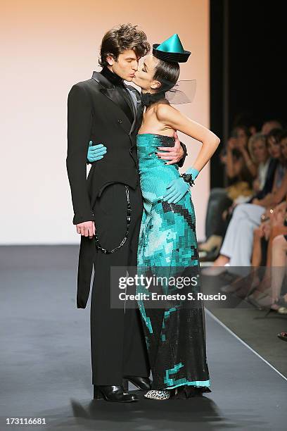 Model walks the runway during the Jean Paul Gaultier Couture fashion show as part of AltaRoma AltaModa Fashion Week Autumn/Winter 2013 on July 7,...