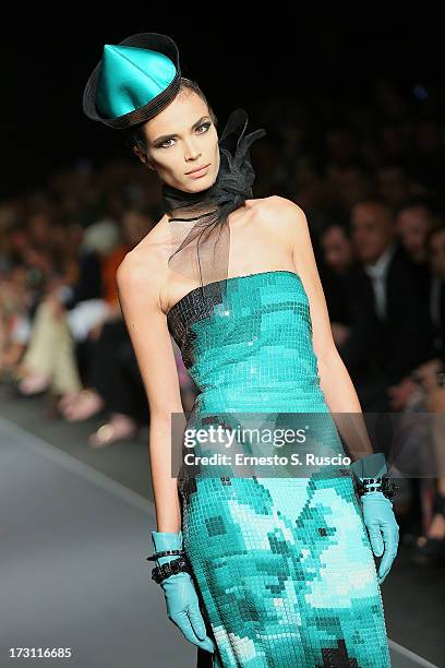 Model walks the runway during the Jean Paul Gaultier Couture fashion show as part of AltaRoma AltaModa Fashion Week Autumn/Winter 2013 on July 7,...