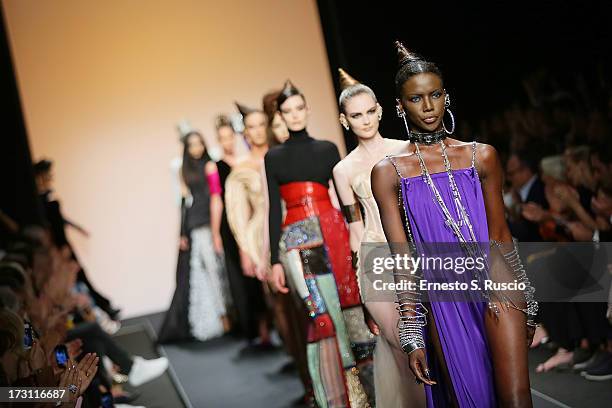 Models walk the runway during the Jean Paul Gaultier Couture fashion show as part of AltaRoma AltaModa Fashion Week Autumn/Winter 2013 on July 7,...