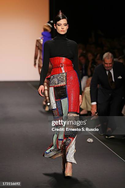 Model walks the runway during the Jean Paul Gaultier Couture fashion show as part of AltaRoma AltaModa Fashion Week Autumn/Winter 2013 on July 7,...