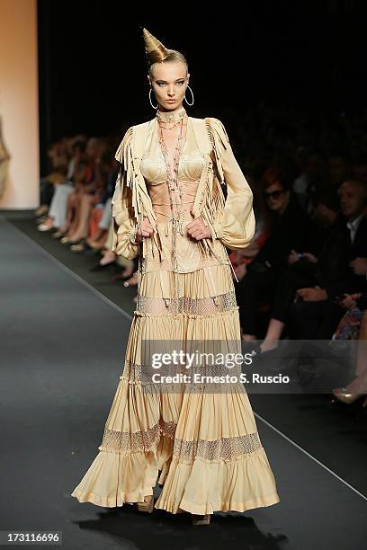 Model walks the runway during the Jean Paul Gaultier Couture fashion show as part of AltaRoma AltaModa Fashion Week Autumn/Winter 2013 on July 7,...