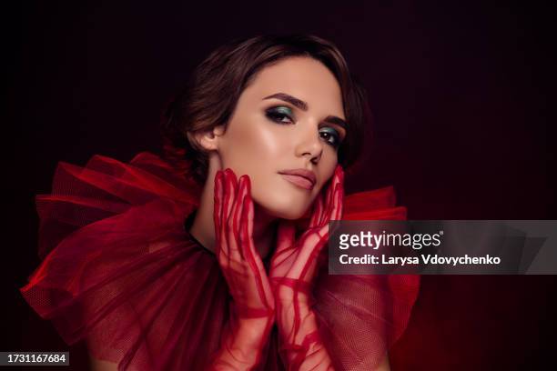photo of stunning performer lady broadway pop star touch make up on face night premiere over dark color background - broadway actor stock pictures, royalty-free photos & images