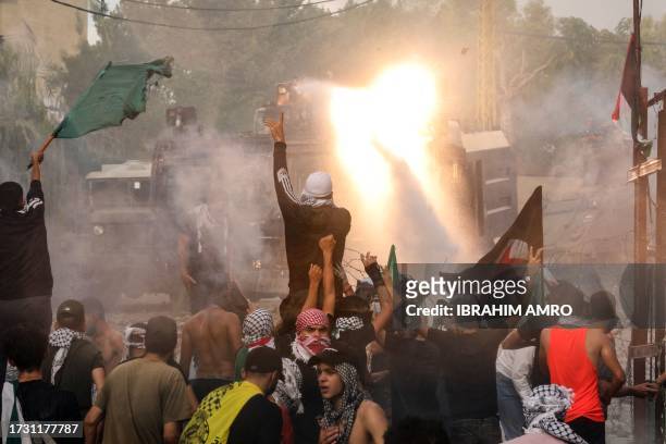 Lebanese security forces use water cannons as they clash with protesters outside the US Embassy in Awkar east of Beirut, during a demonstration in...