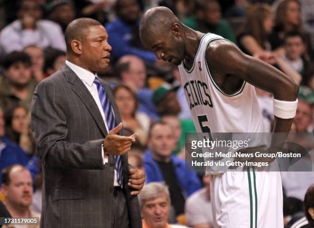 Boston Celtics head coach Doc Rivers talks with power forward Kevin Garnett in the second quarter of an NBA game against the Toronto Raptors at the...