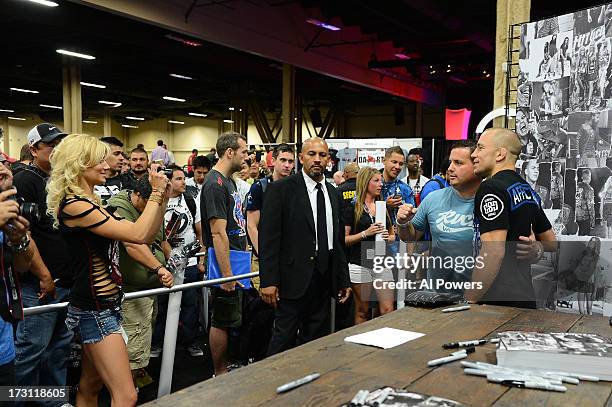 Welterweight champion Georges St-Pierre greets fans during the UFC Fan Expo Las Vegas 2013 at the Mandalay Bay Convention Center on July 6, 2013 in...