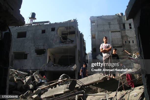 Palestinian citizens inspect damage to their homes caused by Israeli airstrikes on October 12, 2023 in Gaza City, Gaza. At least 1,200 people,...