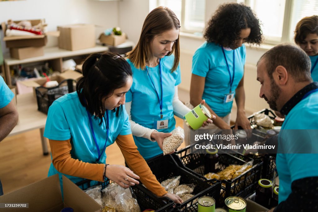 Charity workers packing food donations