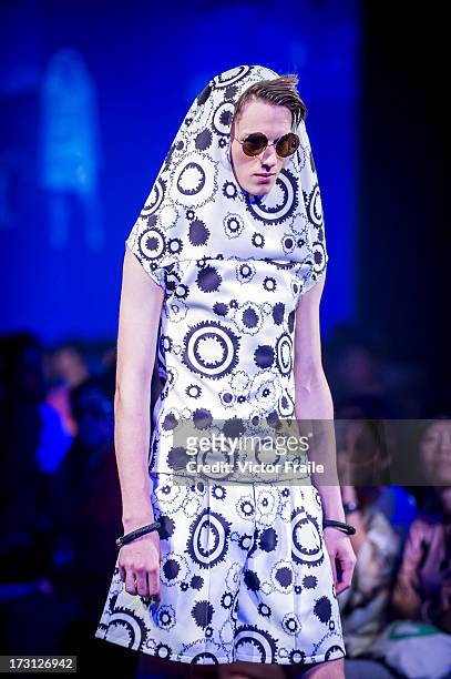 Model showcases designs of Timbee Lo on the runway during the Fashionally Collection show on day 1 of Hong Kong Fashion Week Spring/Summer 2013 at...