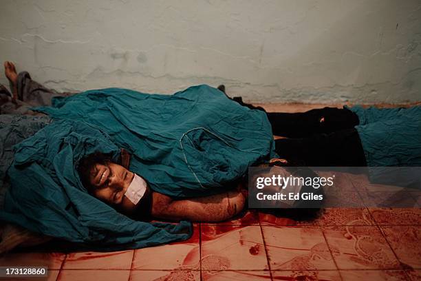 The bodies of men lie on the floor of a morgue at the Liltaqmeen al-Sahy Hospital in Cairo's Nasr City district, after allegedly being killed during...