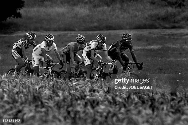 Belgium's Thomas De Gendt, Japan's Arashiro Yukiya, France's Romain Sicard, France's Anthony Delaplace, and France's Kevin Reza ride in the breakaway...