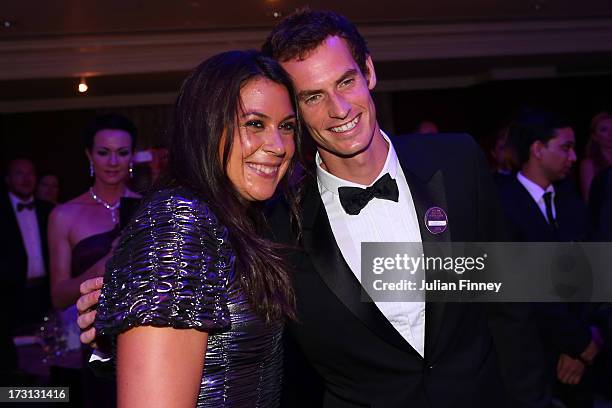 Ladies' Singles Champion Marion Bartoli of France poses with Gentlemen's Singles champion Andy Murray of Great Britain at the Wimbledon Championships...