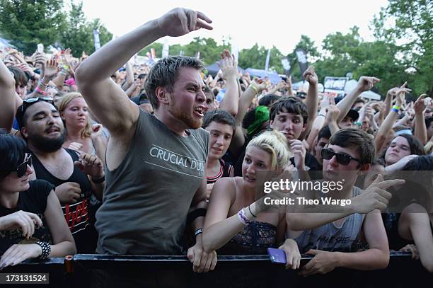 Fan gets very into the music during Warped Tour 2013 at PNC Bank Arts Center on July 7, 2013 in Holmdel, New Jersey.