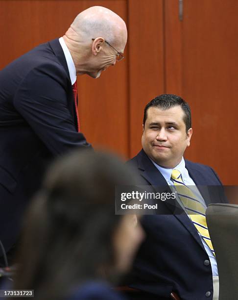 George Zimmerman is greeted by defense counsel Don West at the start of the 20th day of his trial in Seminole circuit court July 8, 2013 in Sanford,...